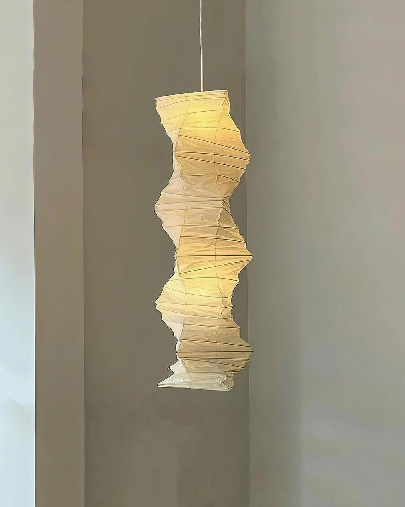 Akari 33N tall pendant light in modern home setting showing scale and presence in interior space
