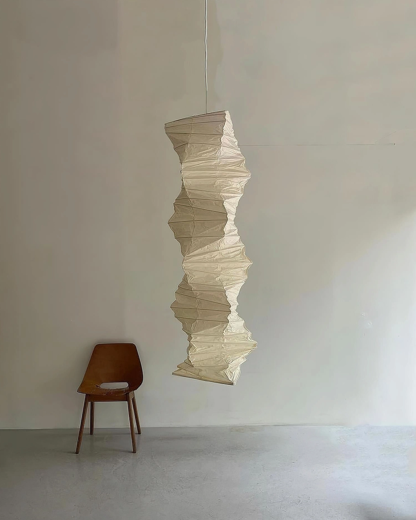 Akari 33N paper pendant shade detail photography highlighting craftsmanship and folded paper artistry
