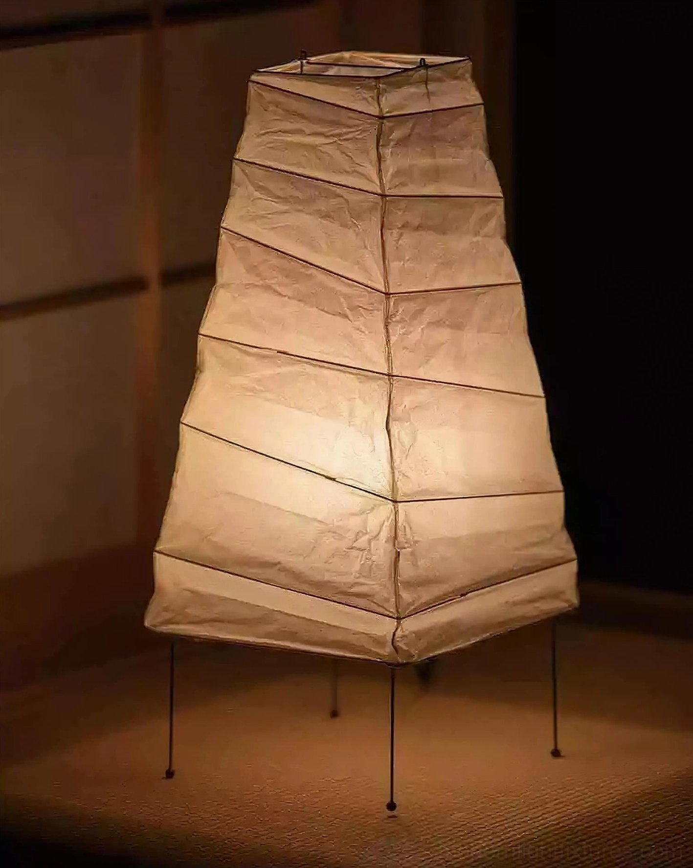 Akari 4N lit table lamp glowing warm light in traditional tatami room setting