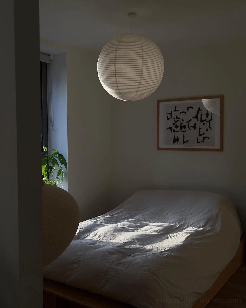 Akari A pendant lamp installed in contemporary home with neutral interior