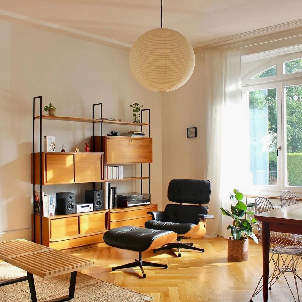 Akari A pendant light in mid-century modern room with wooden shelving unit