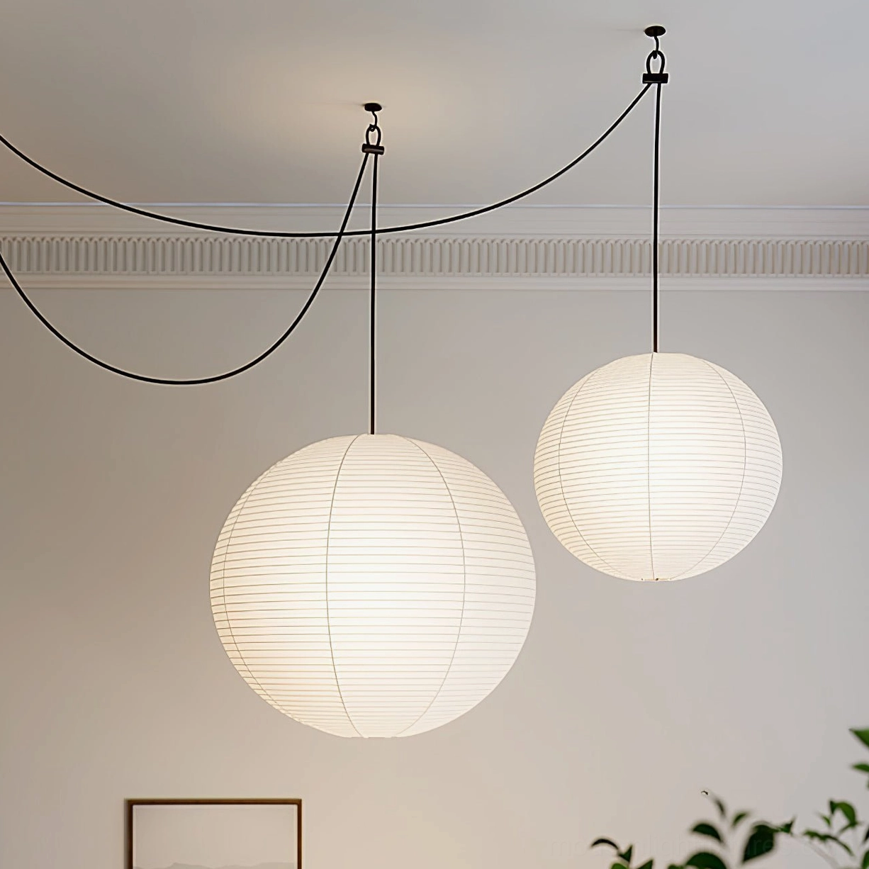 Akari paper shade pendant lamp with black hanging cord in minimalist modern residential interior