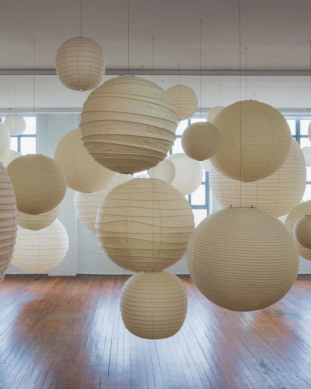 Modern Japanese Washi paper pendant lamp - 55cm size hanging in contemporary space with minimalist aesthetic