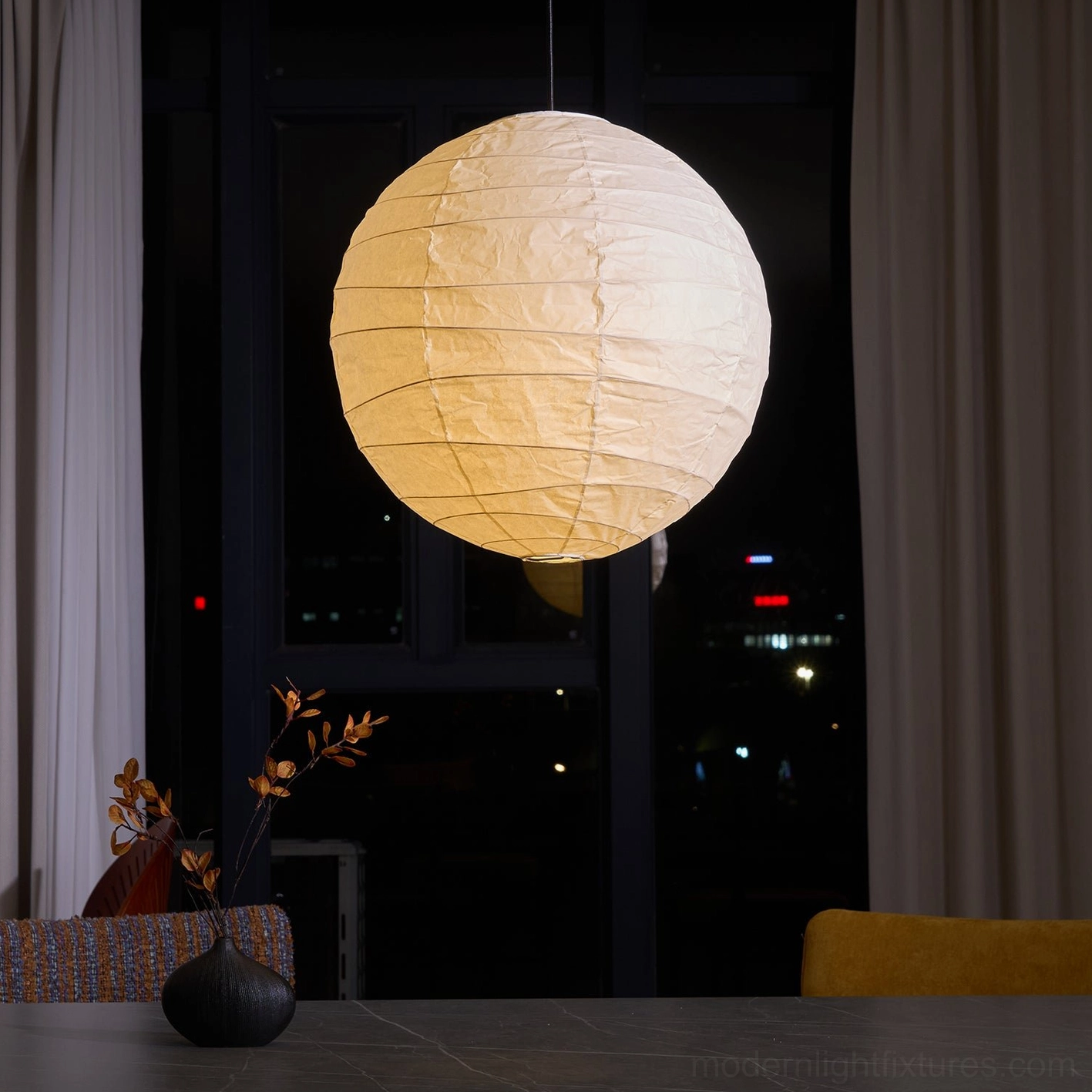 Akari D Series pendant lamp - warm white paper creating inviting dining space atmosphere
