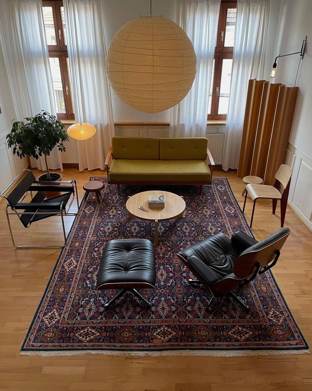 Overhead view of Akari D pendant lamp in spacious mid-century loft - neutral beige paper shade with retro interior