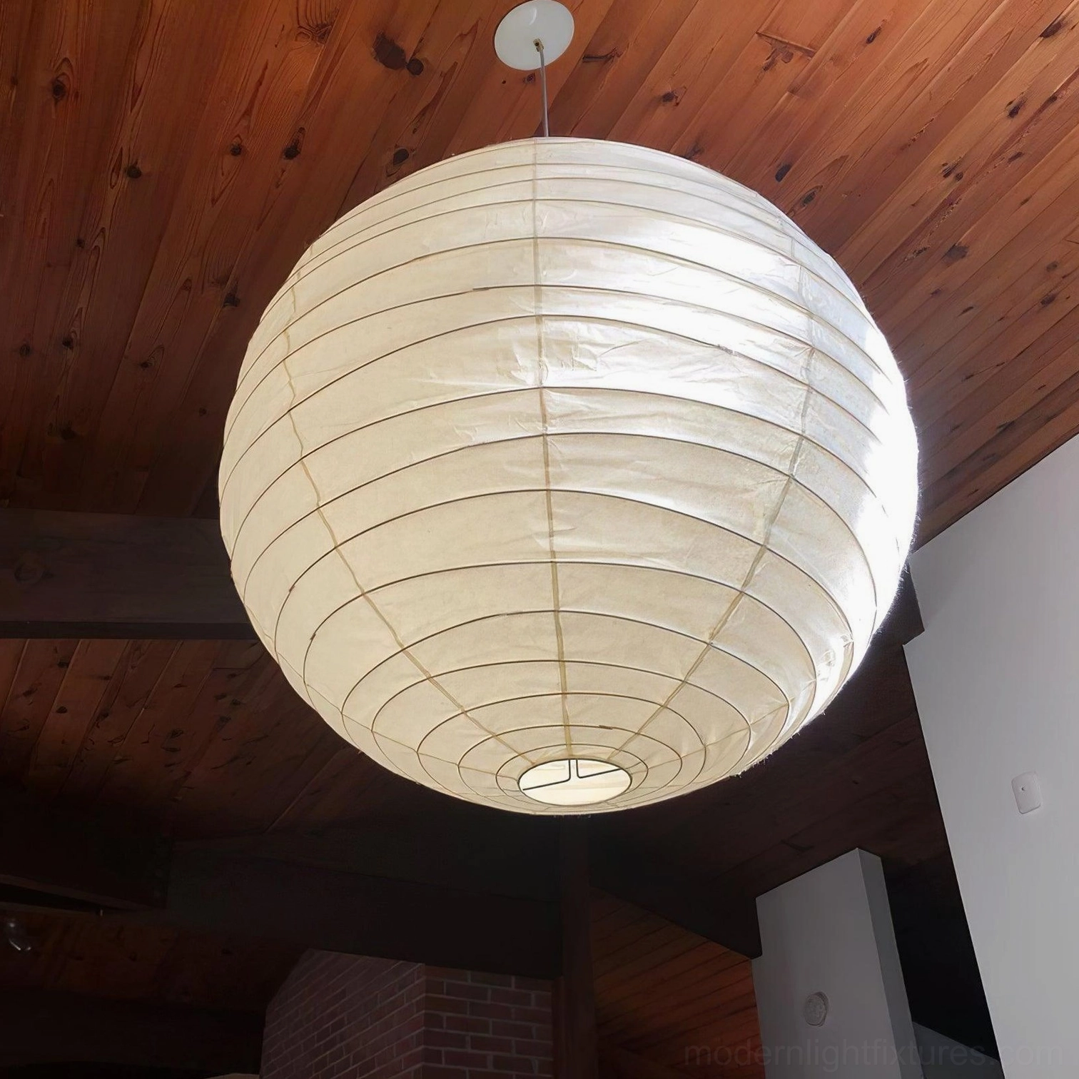 Japanese Washi paper pendant lamp - hung at optimal height above dining table