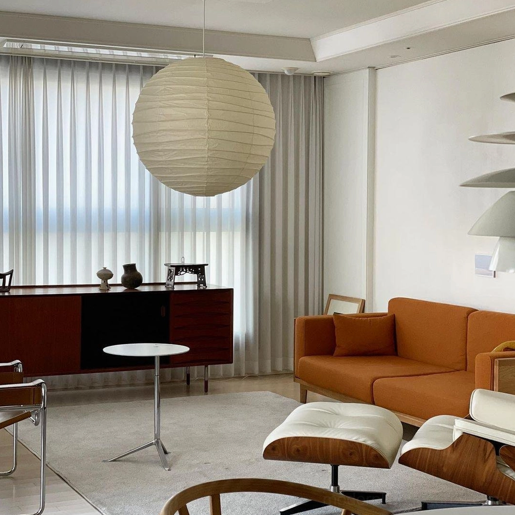 Akari D Series pendant lamp - soft white paper shade creating ambient room lighting