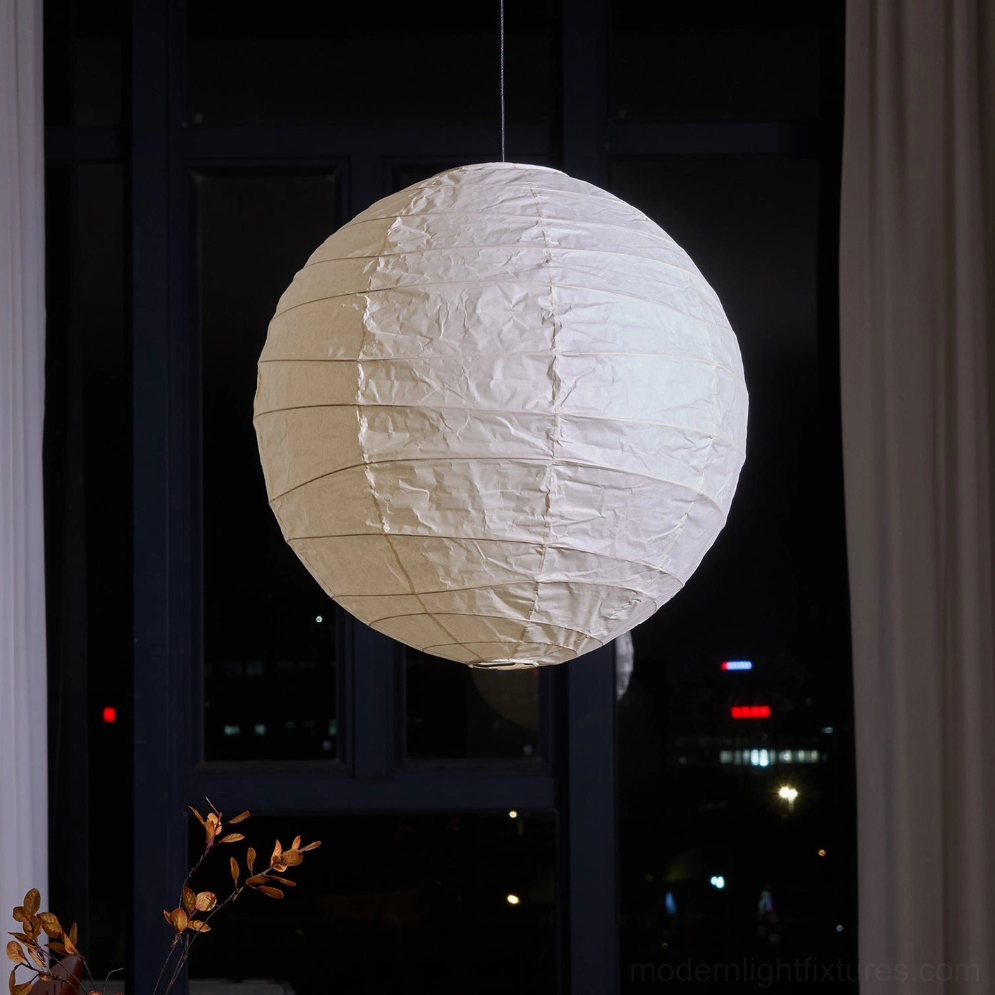 Modern Japanese Washi pendant lamp - half-view showing spherical paper geometry