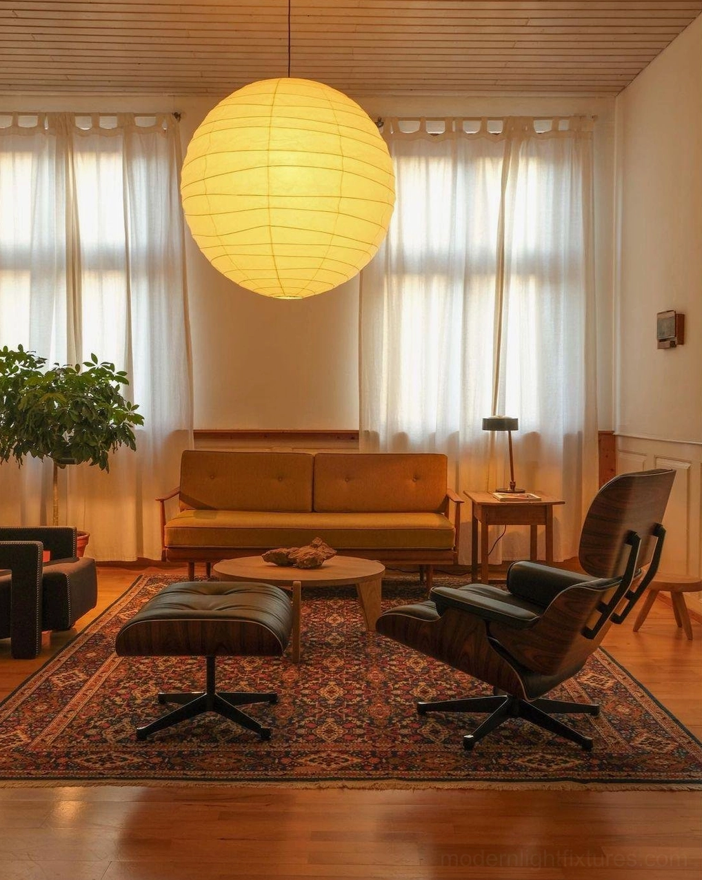 Japanese Washi pendant lamp hanging in sunlit mid-century living room - warm yellow shade with sheer window