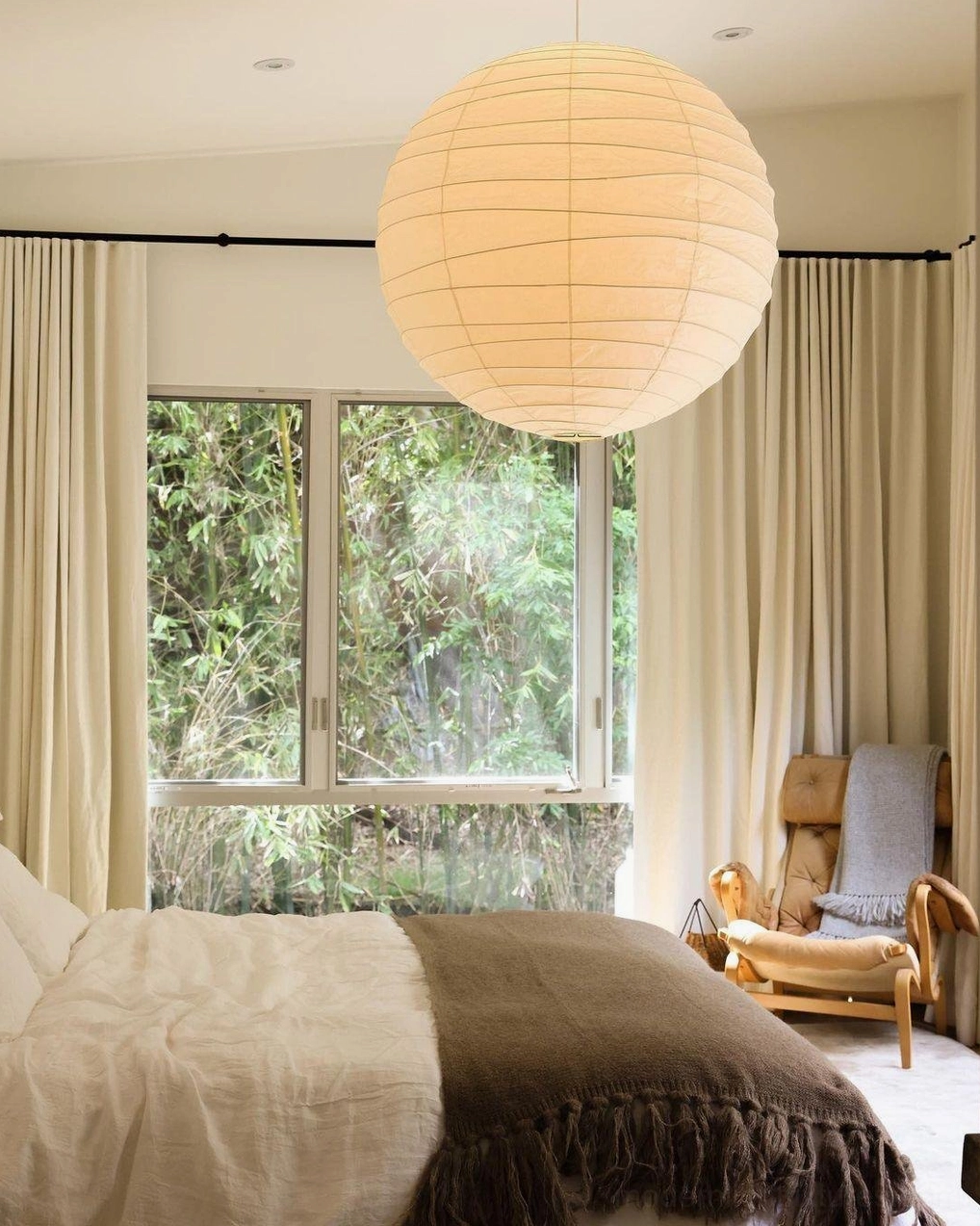 Akari D Series pendant lamp - warm white Washi paper shade creating diffused light in dining space