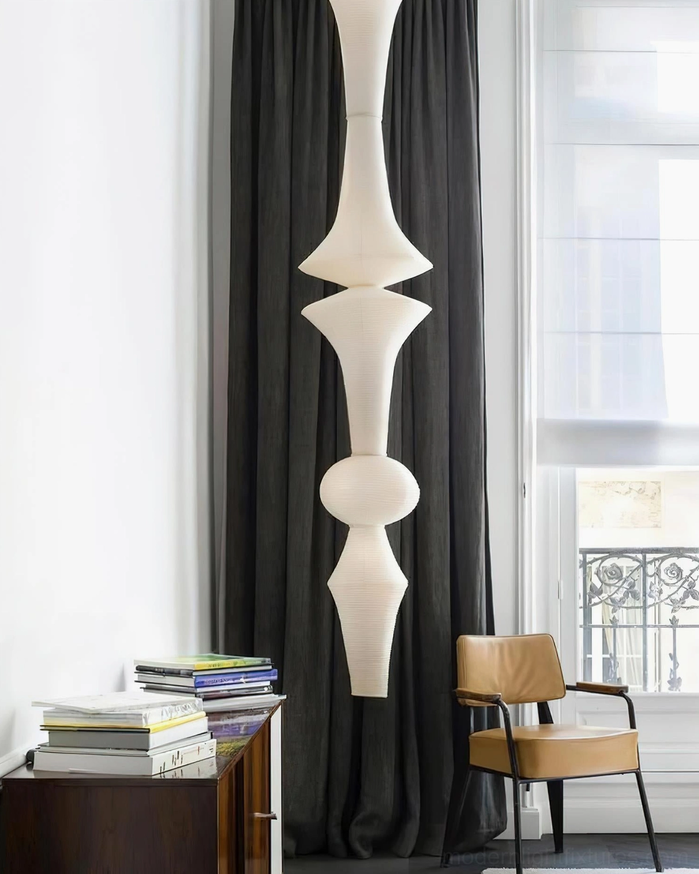 Akari E pendant lamp paired with mid-century modern furniture and minimalist home office decor