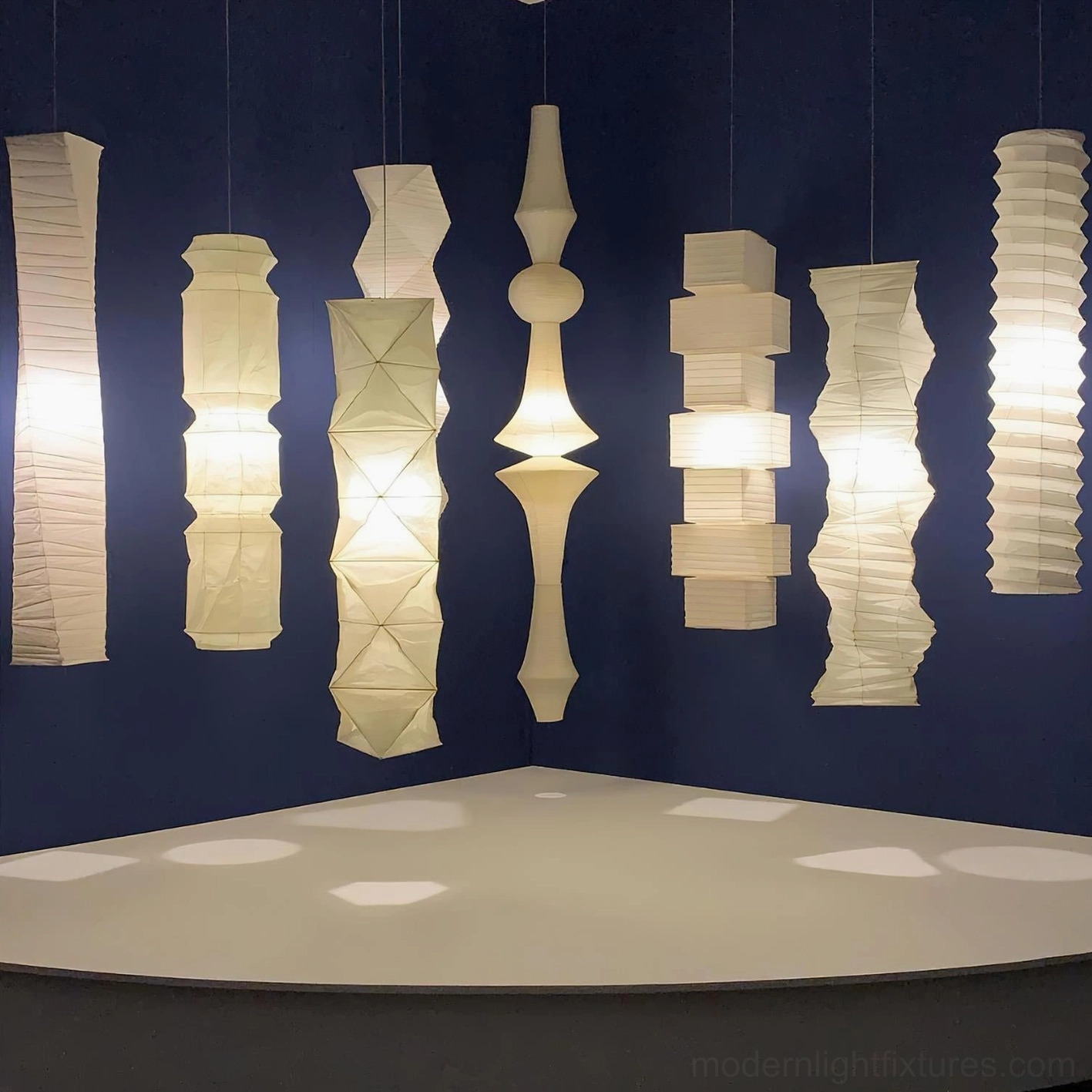 Akari E white mulberry paper pendant lamp showing natural fiber texture and light diffusion