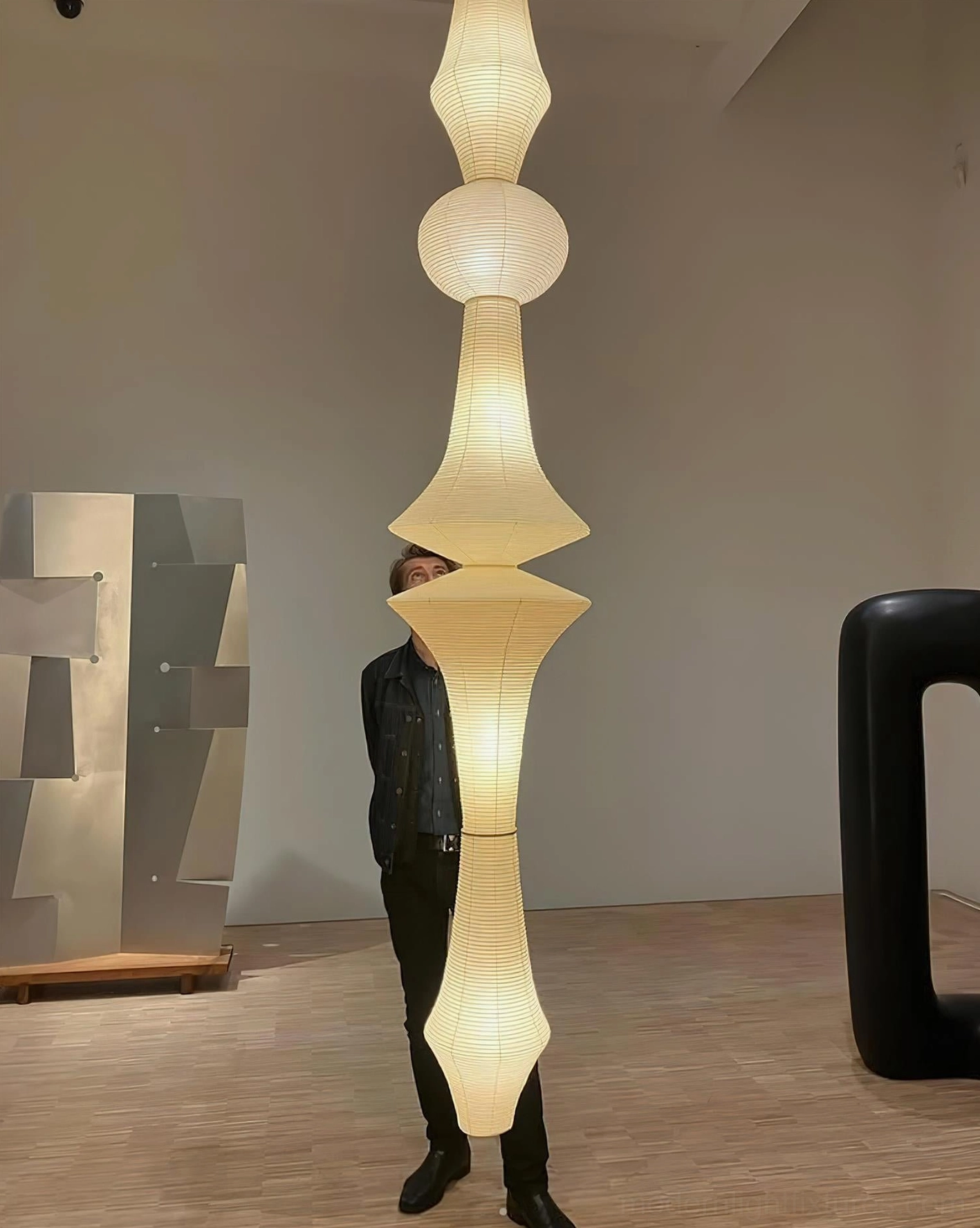Akari E pendant lamp sloped ceiling compatible fixture installed on angled architectural ceiling