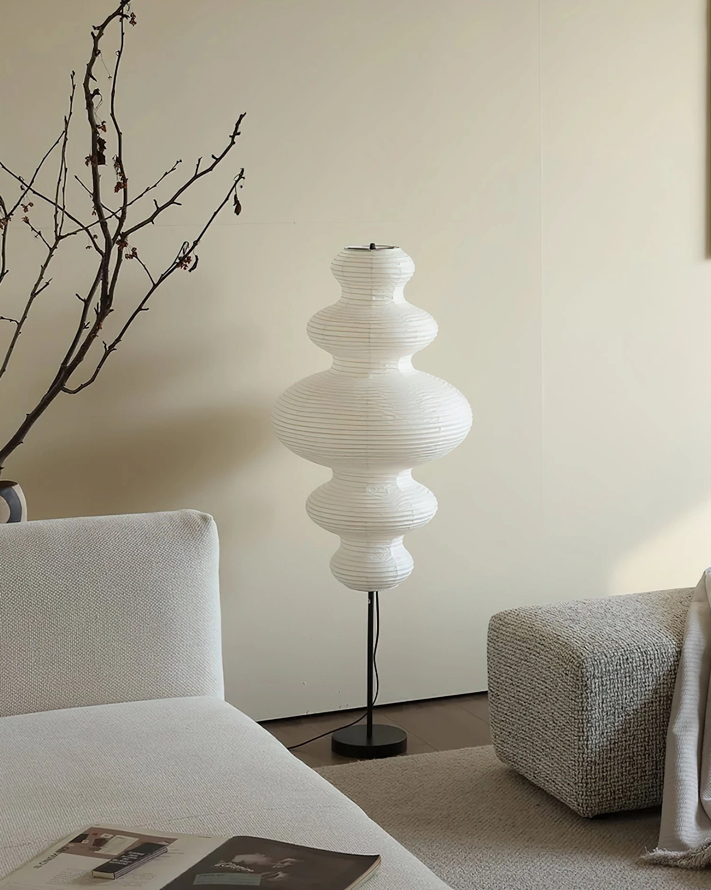 Akari Juni handcrafted floor lamp with wrinkled paper shade in contemporary home setting