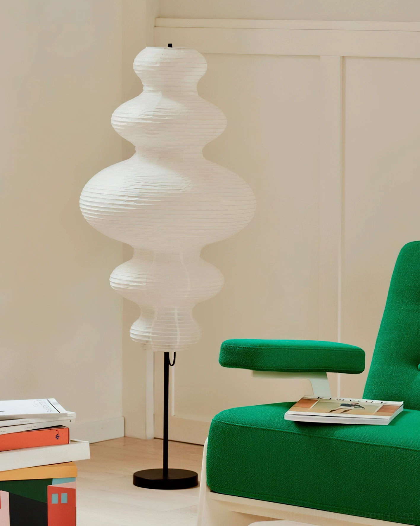 Akari Juni white paper floor lamp in Nordic interior with green armchair, minimalist décor
