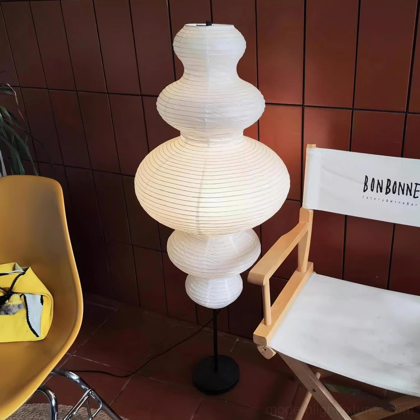 Handcrafted Xuan paper floor lamp with textured white shade creating warm diffused illumination