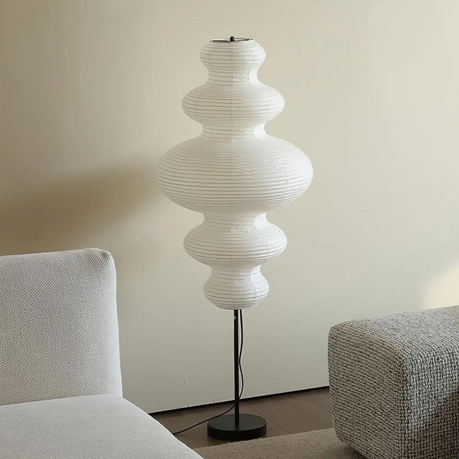 Modern Noguchi-inspired floor lamp in contemporary living room setting, minimalist home décor