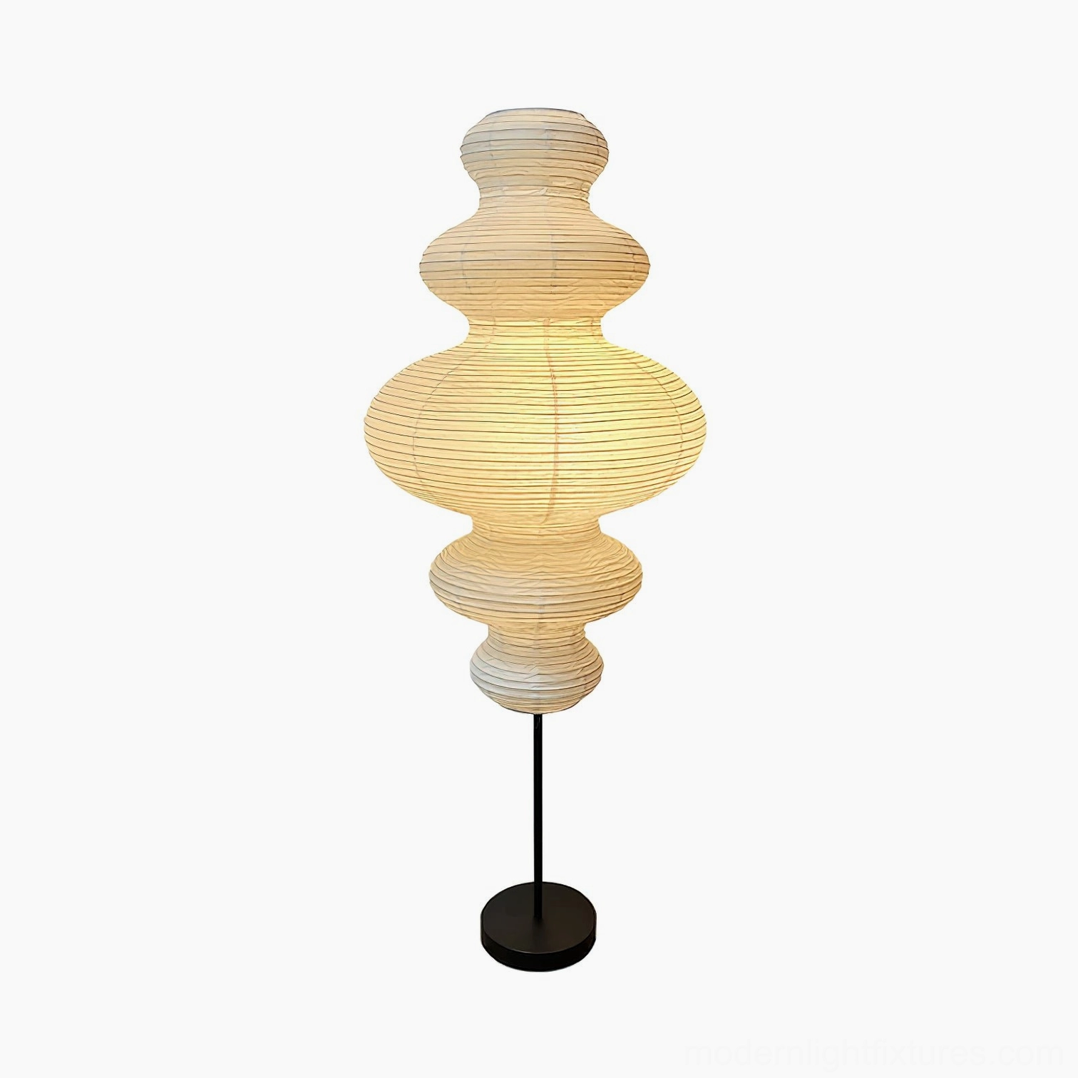 Akari Juni floor lamp illuminated creating soft ambient light in minimalist modern space