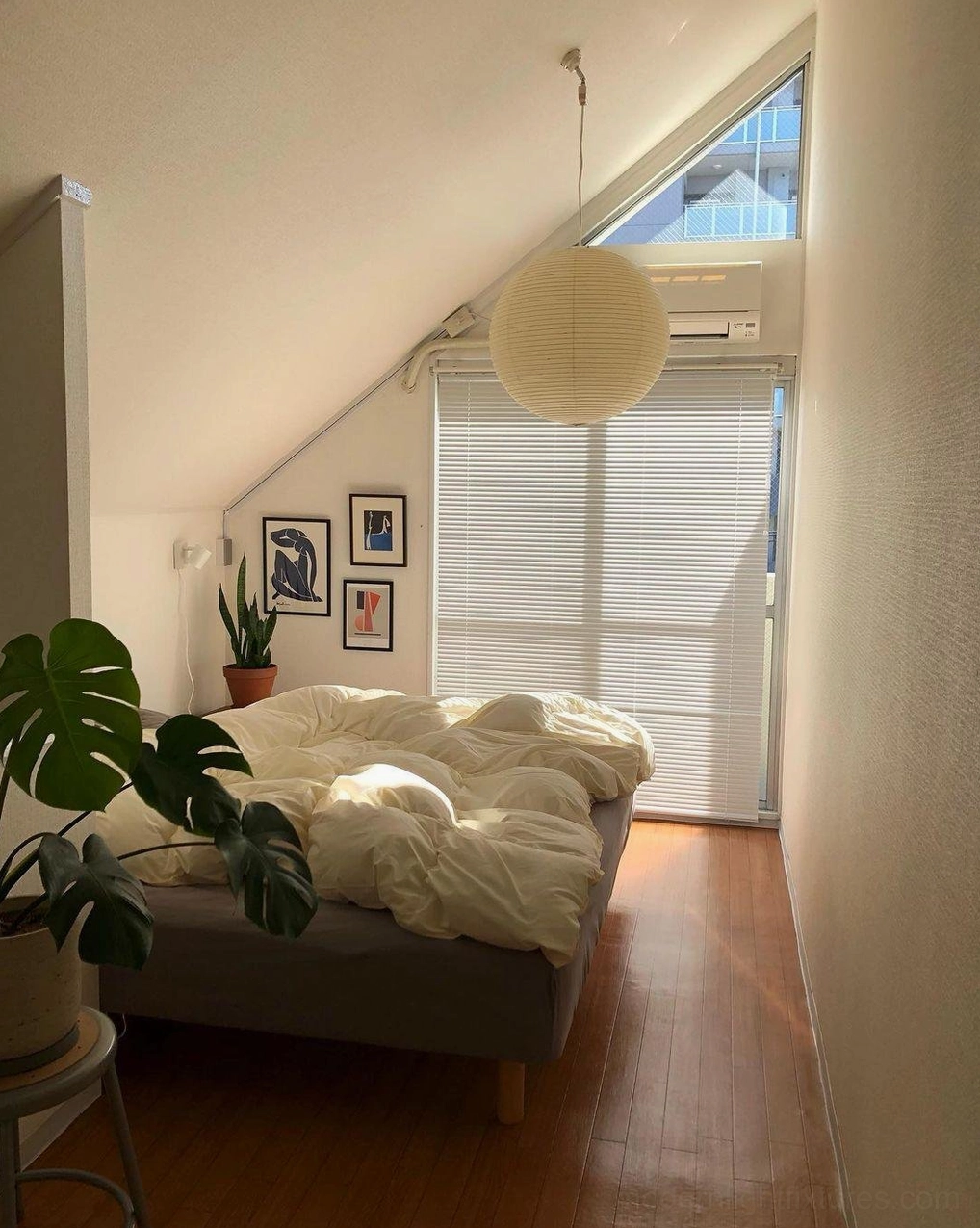 Akari A Series pendant lamp in attic bedroom with minimalist decor