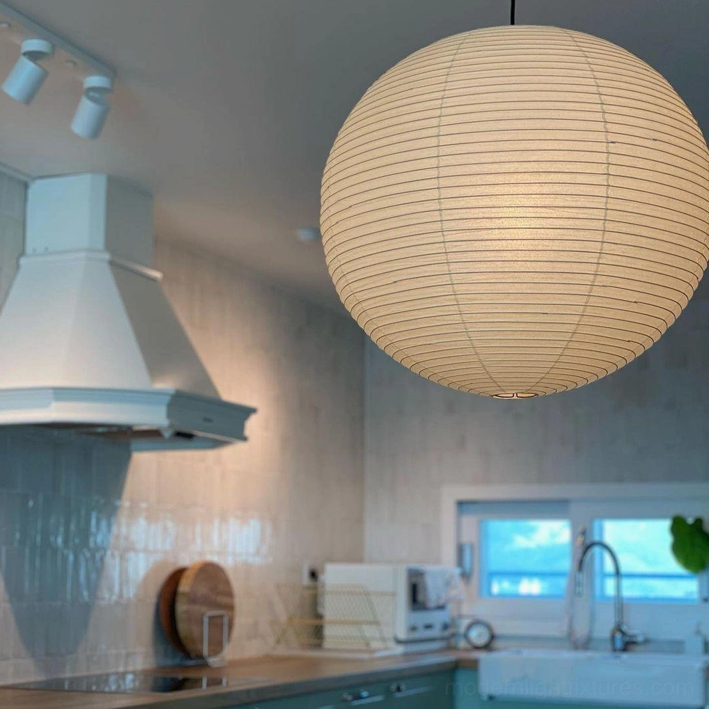 Akari Round 30cm pendant lamp as accent lighting in reading corner nook
