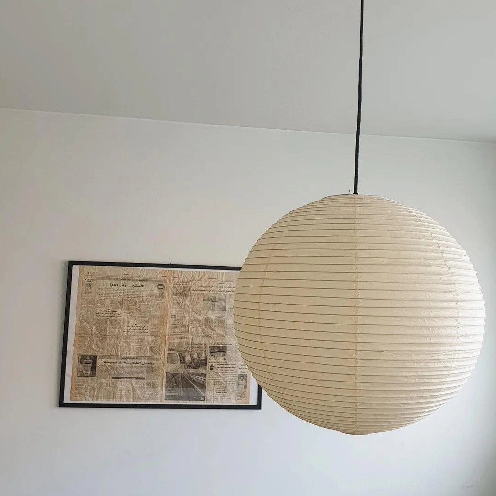 Akari Round 60cm pendant lamp above round dining table in contemporary home
