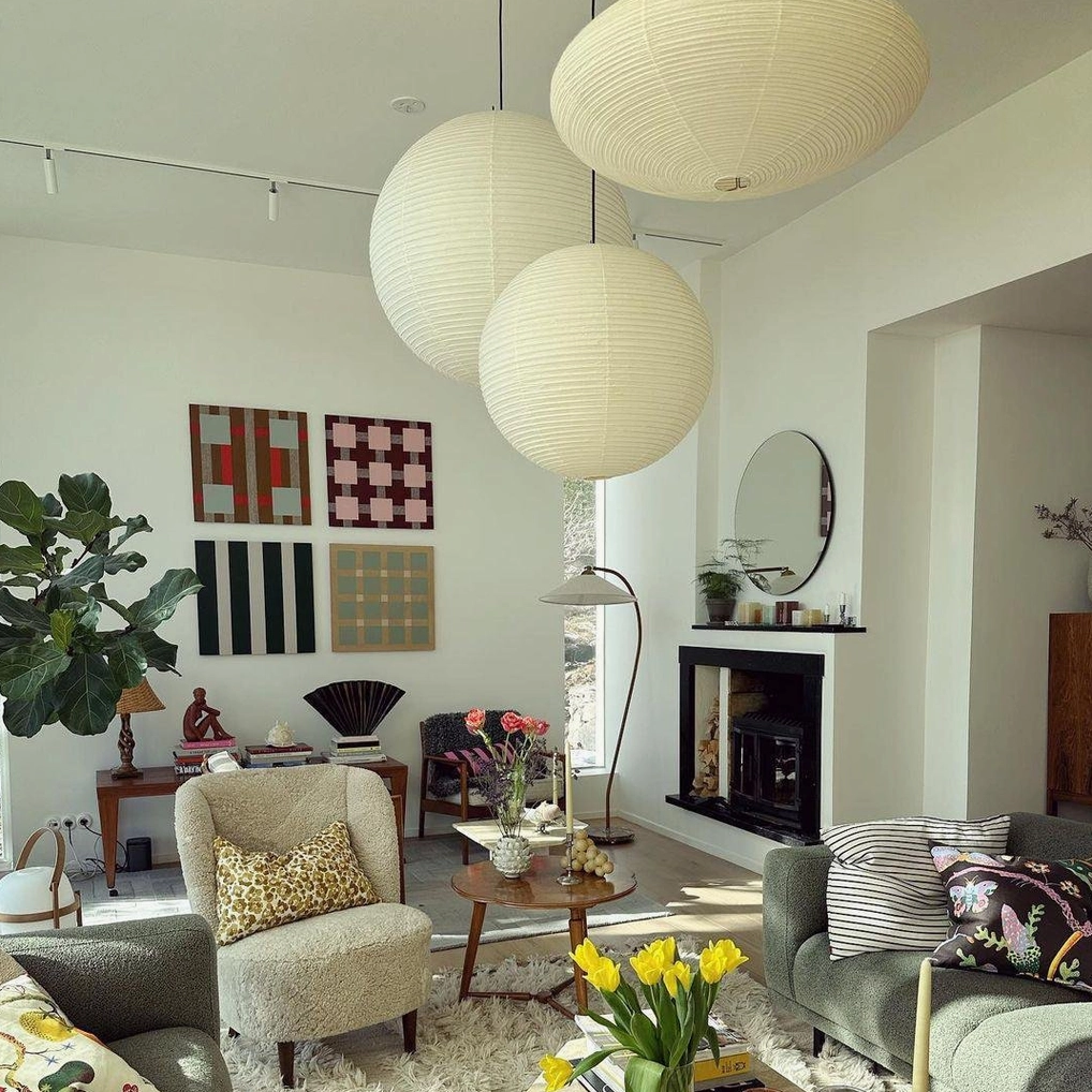Akari Round pendant lamps at multiple heights creating layered ambient lighting effect