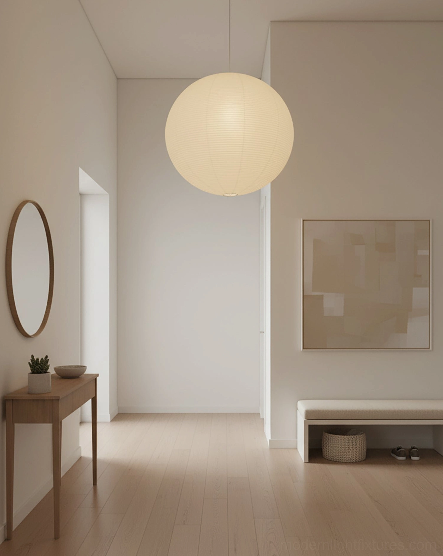 Multiple Akari Round pendant lamps at varying heights in stairwell cascade arrangement
