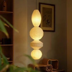 Akari Tayo pendant lamp glowing warm light in residential corner wooden decor wrinkled paper texture
