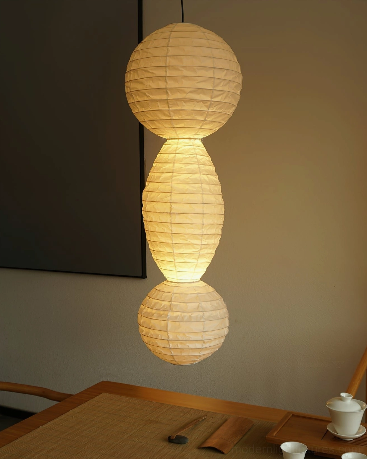 Akari Tayo three-tiered paper pendant lamp in Japanese tea room dining area with warm glow