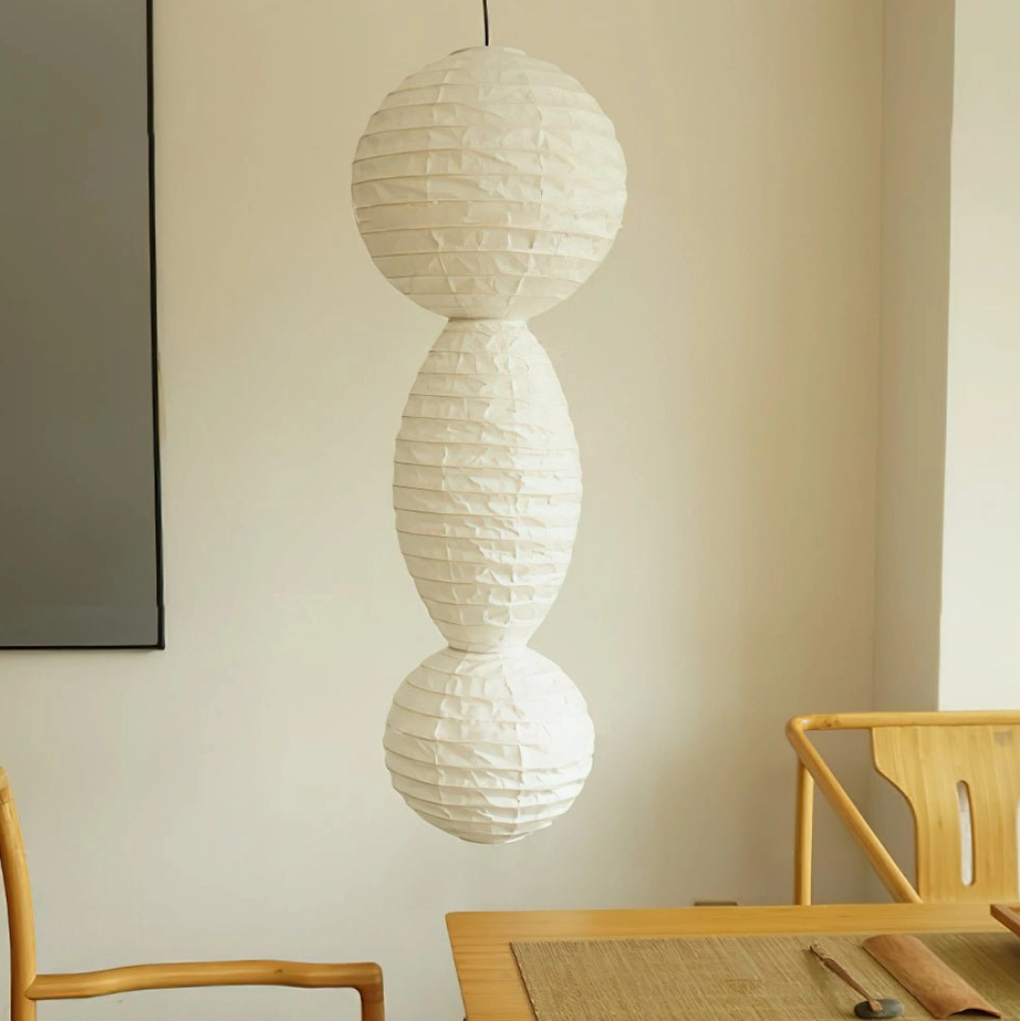 Akari Tayo white washi paper pendant light unlit in minimalist dining room setting