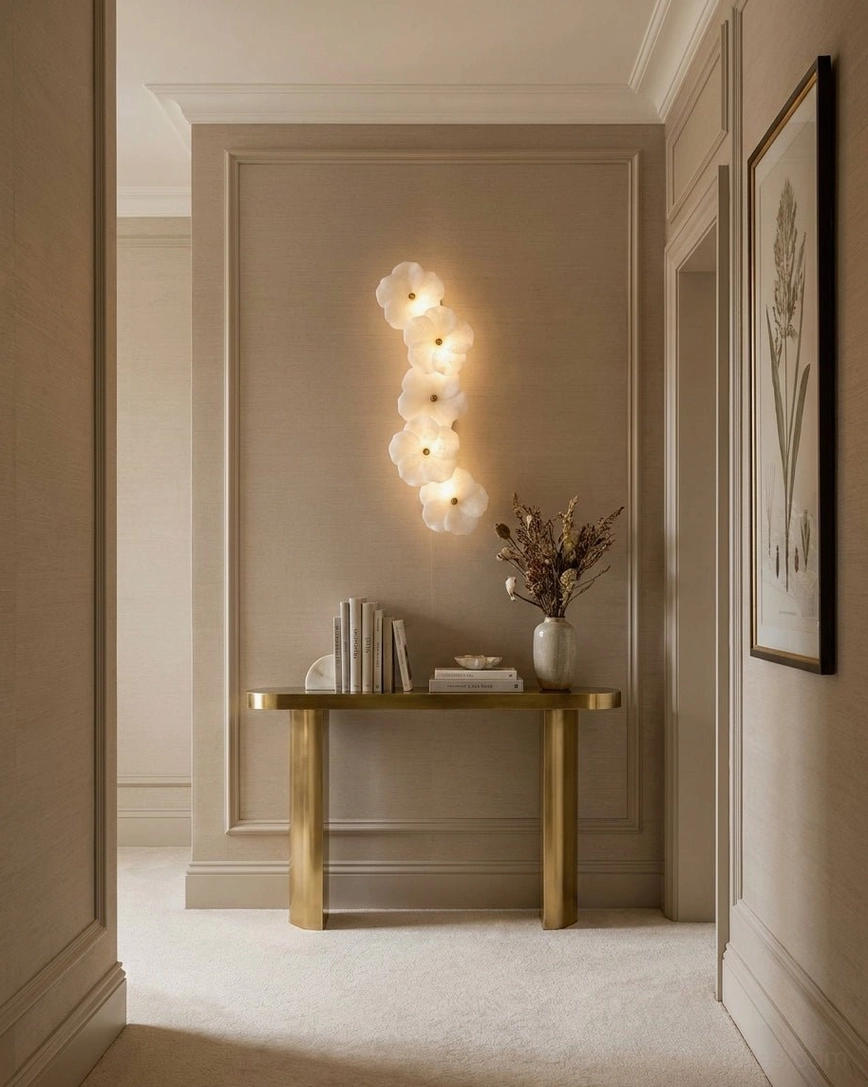 Alabaster Bloom Wall Sconce illuminating residential hallway, warm accent lighting design