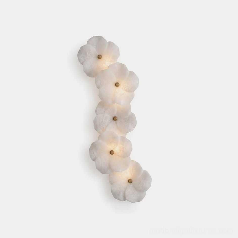 Alabaster Bloom Wall Sconce with carved floral cluster and brass centers, front studio view