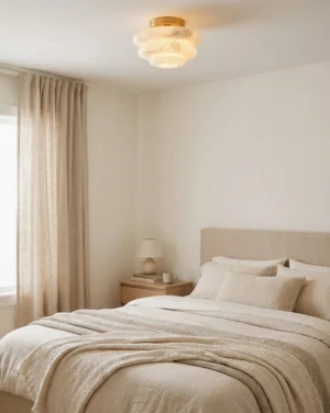Alabaster flush mount lighting fixture installed in modern bedroom, overhead view showing warm glow through translucent stone