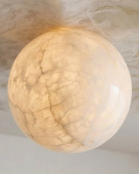 Alabaster flower flush mount ceiling light showing soft ambient illumination glow through translucent carved stone petal lobes