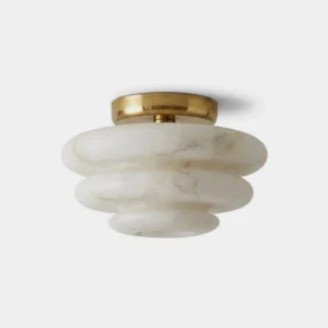 Alabaster flush mount ceiling light with tiered white marble stone shade and warm brass canopy, front product view
