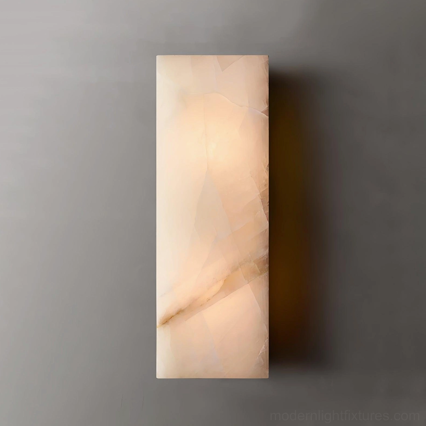 Modern alabaster wall sconce dark accent wall contrast depth visual interest luminous fixture