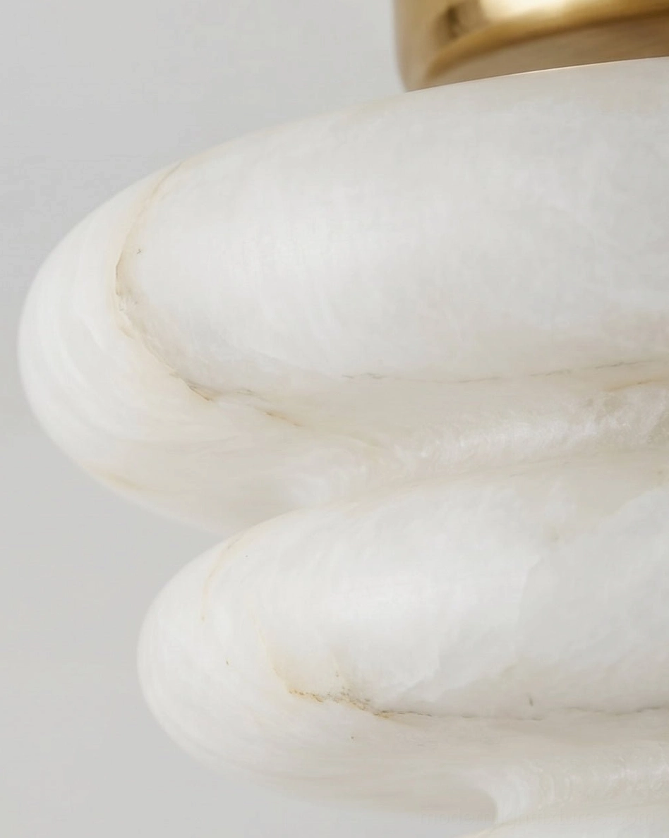 Close-up macro detail of tiered alabaster stone shade showing natural marble veining and brass hardware