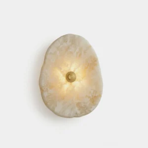 Hand-cut alabaster wall sconce with brass mount, frontal studio view showing natural stone veining and warm backlit glow