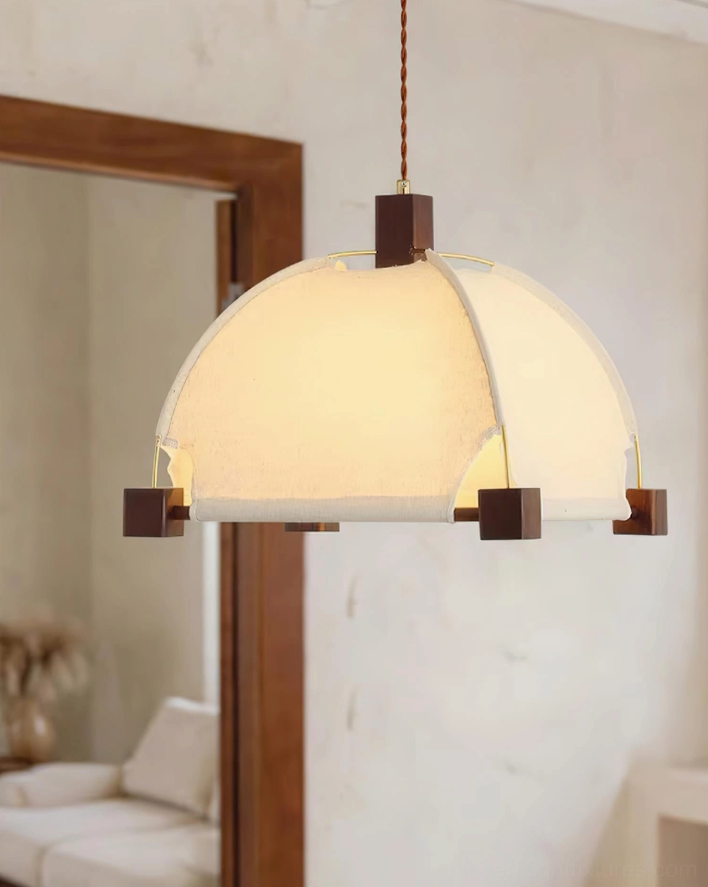 Allegra pendant lamp showing warm light diffusion through fabric shade in interior space