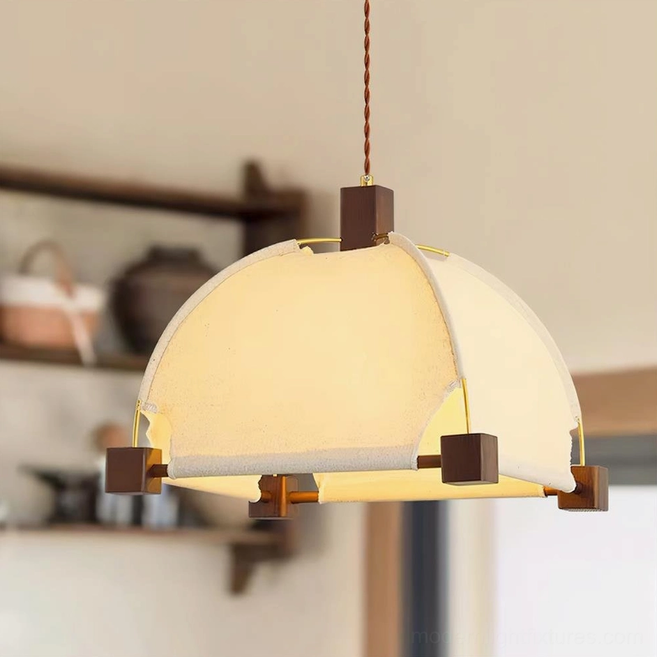 Close-up view of Allegra modern fabric pendant light displaying off-white shade and walnut wood fixtures