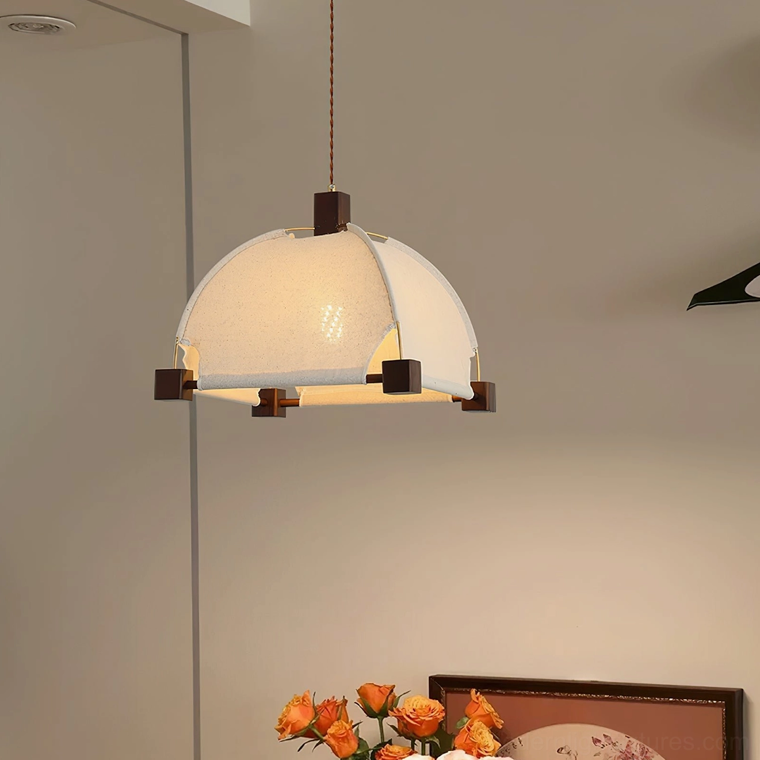 Allegra fabric pendant lamp with dark wood accents in dining room interior - warm ambient lighting
