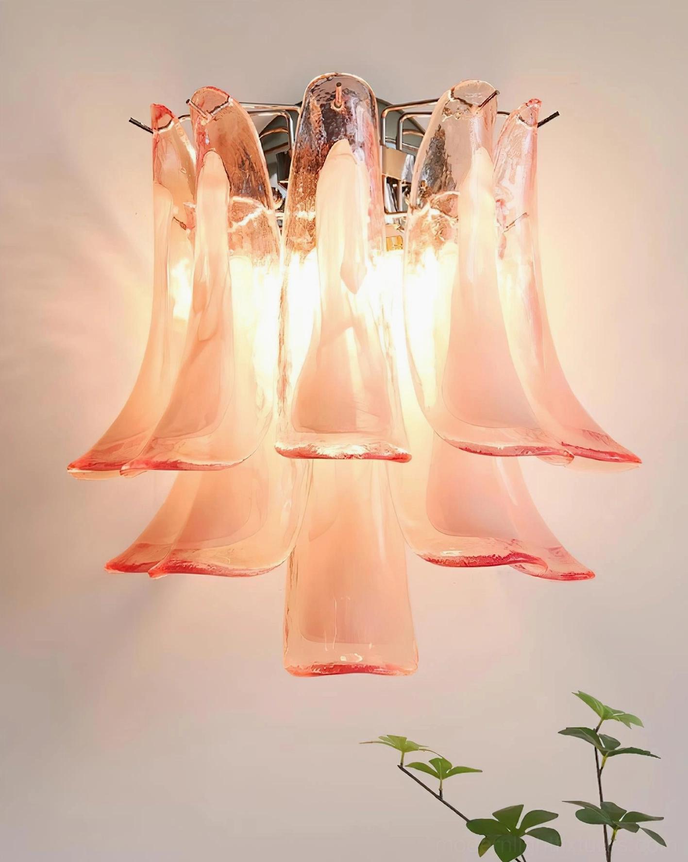 Alrinis flower-shaped glass wall sconce overhead view chrome metal base with peach-pink glass