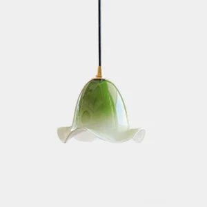 Aluna hand-blown glass pendant light with ruffled organic glass shade in gradient pink, brass hardware, studio view