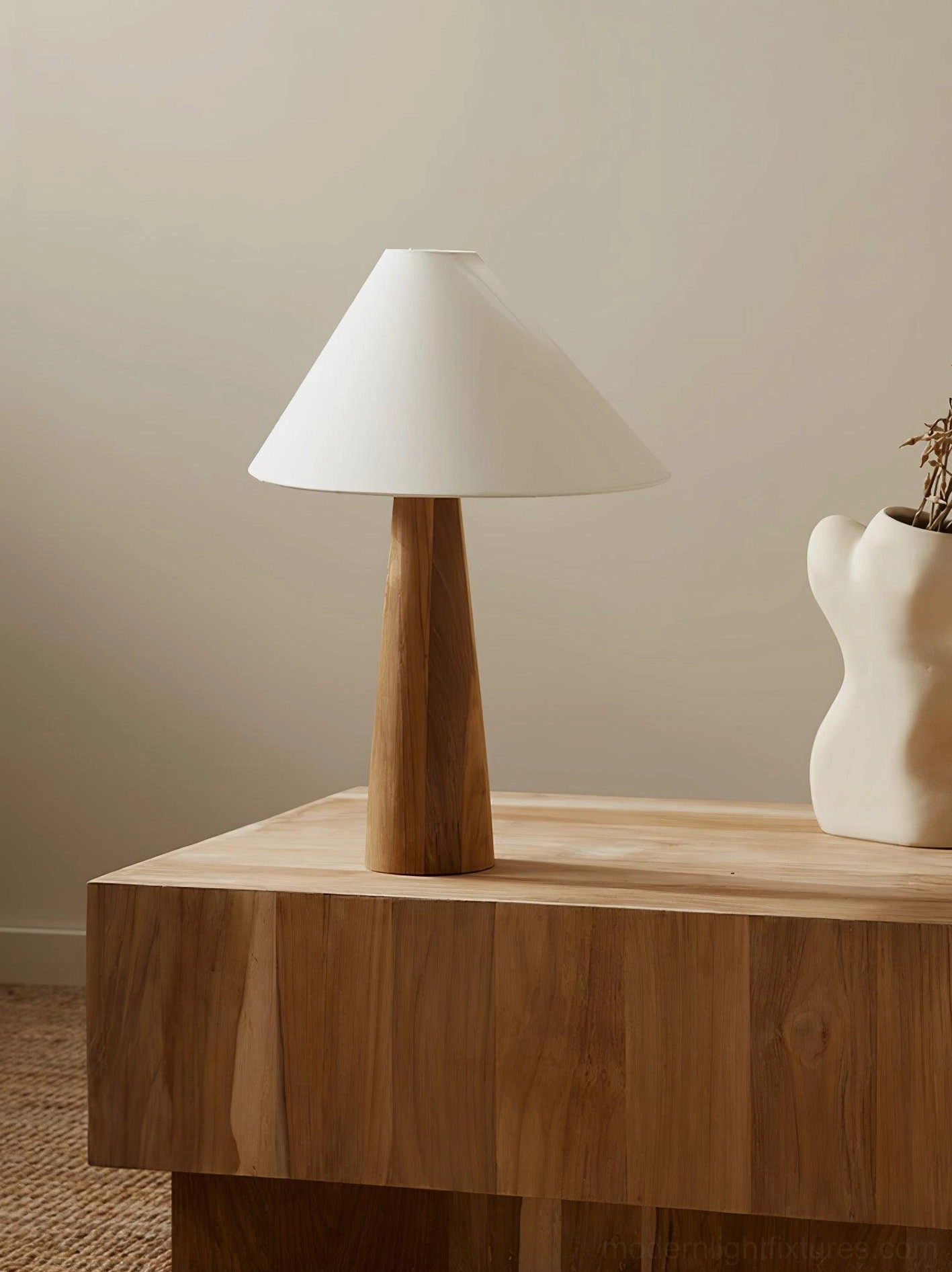 Contemporary Alvin table lamp with asymmetrical linen shade on wooden side cabinet with decorative dried flowers