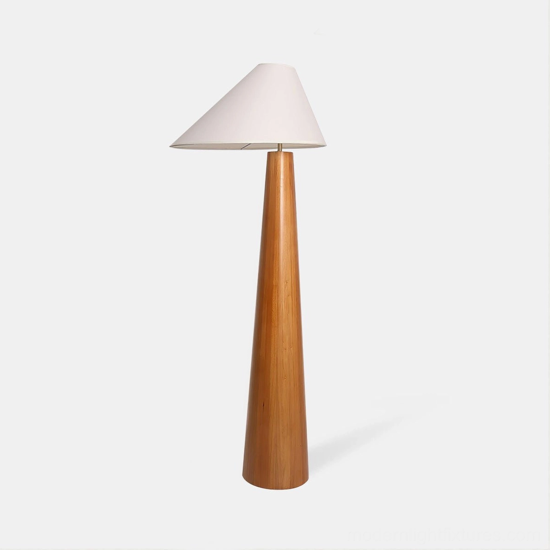 Alvin natural wood floor lamp with off-white linen asymmetrical shade, front studio view showcasing tapered wooden pole and conical fabric shade design