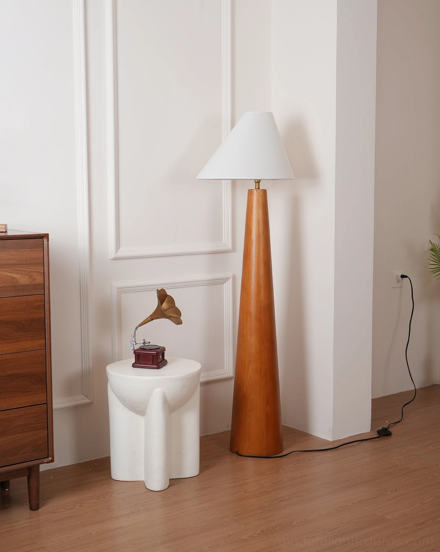 Contemporary wooden floor lamp with off-white linen asymmetrical shade, studio lighting detail showing fabric weave and shade shape