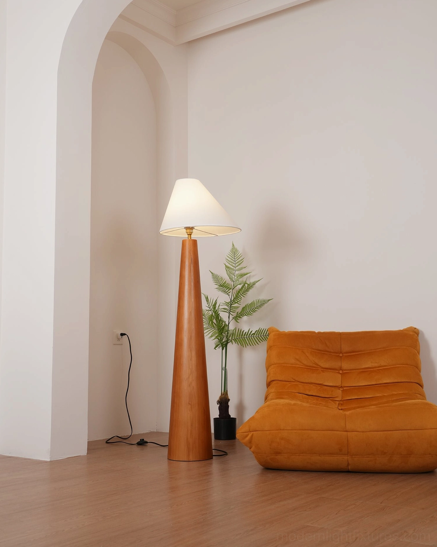 Scandinavian floor lamp with natural wood base and white linen fabric shade, clean minimalist design in neutral interior setting