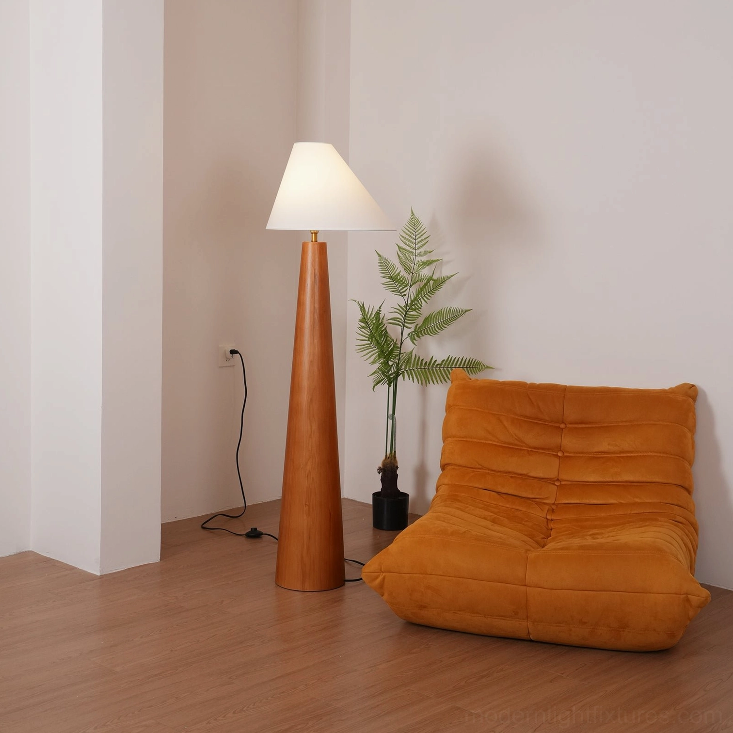 Tapered wooden floor lamp with off-white conical linen shade, contemporary design detail view highlighting craftsmanship and materials
