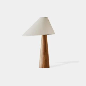 Alvin natural wood table lamp with linen shade, front three-quarter view showing organic wooden base and asymmetrical fabric lampshade