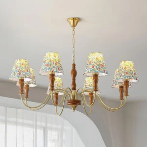 Alyssa floral chandelier installed in modern dining nook with brass finish and wooden details